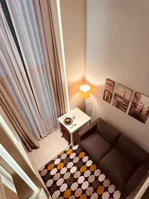 a small living room with a couch and a table at Ortakoy Aparts in Istanbul