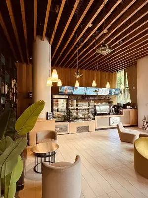 a restaurant with tables and chairs and a kitchen at Ortakoy Aparts in Istanbul