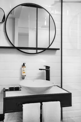 a bathroom with a sink and a large mirror at The Westist Hotel & Spa - Special Category in Istanbul