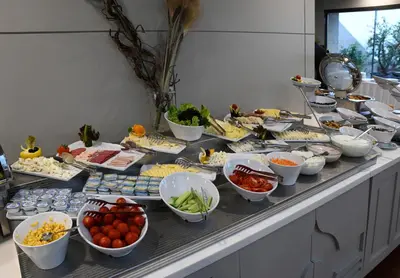 a buffet with many plates of food on a table at Taksim Square Hotel in Istanbul