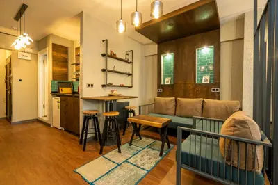 a living room with a couch and a table at Cube Suites in Istanbul