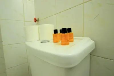 a white sink in a bathroom with toiletries on it at Istanbul Metro Hotel in Istanbul