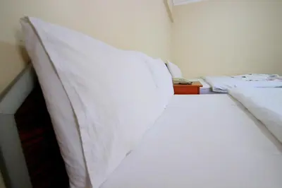 a bedroom with two beds with white pillows at Istanbul Metro Hotel in Istanbul