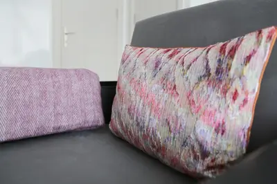 two pillows sitting on a couch next to each other at Bayer Hotel in Istanbul