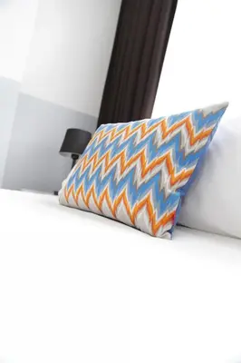 a pillow sitting on top of a white table with at Bayer Hotel in Istanbul