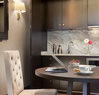 a kitchen with a table with a laptop on it at Barceló Istanbul in Istanbul