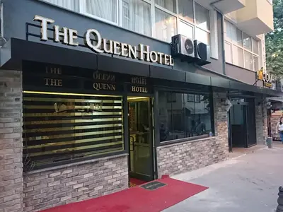 a building with a sign that reads the queen hotel at The Queen Hotel in Istanbul