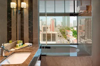 a bathroom with a sink and a large window at Renaissance Istanbul Polat Bosphorus Hotel in Istanbul