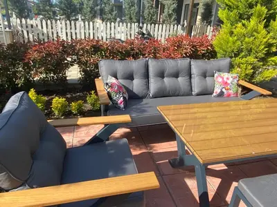 a couch and a table on a patio at Eleia Hotel İznik in Bursa