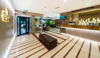 a bowling alley with a leather seat in a mall at Aprilis Hotel - Special Category in Istanbul