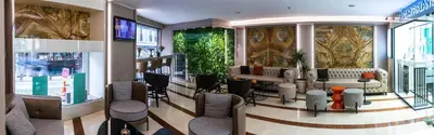 a lobby with a waiting room with chairs and tables at Aprilis Hotel - Special Category in Istanbul