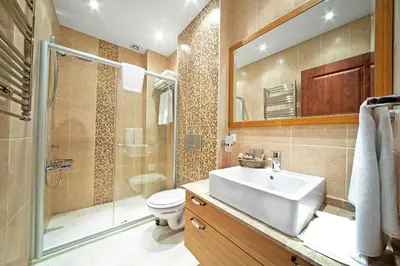 a bathroom with a sink and a shower and a toilet at Dilhayat Kalfa Hotel in Istanbul