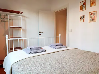 a bedroom with a bed with towels on it at Kunterbunt Istanbul in Istanbul