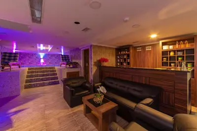 a bar with purple lighting in a room at Vision Deluxe Hotel in Istanbul