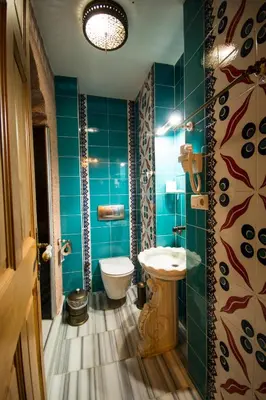 a bathroom with a toilet and a sink at Sultan Corner Hotel in Istanbul