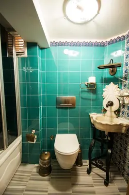 a bathroom with a toilet and a sink at Sultan Corner Hotel in Istanbul