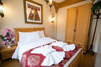 a bedroom with a bed with two towels on it at Sultan Corner Hotel in Istanbul