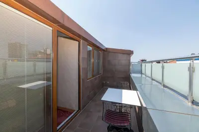 a balcony with a table on a building at Regno Hotel in Istanbul