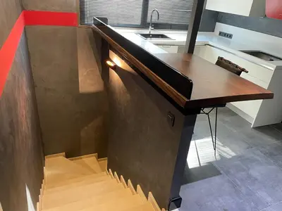 a kitchen with a wooden counter with a sink at Feri Suites in Istanbul