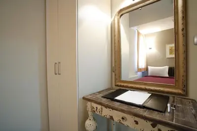 a bathroom with a mirror and a sink at Home Stay Home Sisli in Istanbul