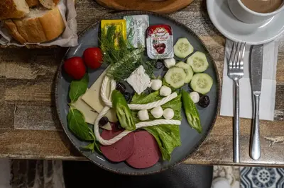a plate of food with vegetables on a table at Family Istanbul Hotel in Istanbul