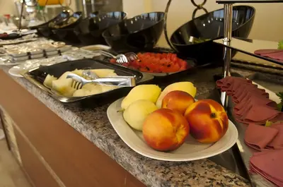 a table with a plate of fruit on a counter at Abel Hotel in Istanbul