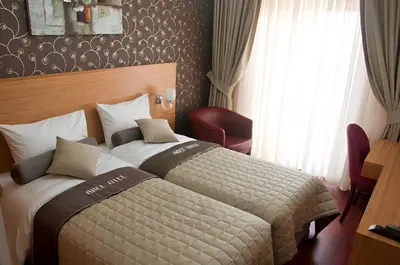 a hotel room with two beds and a window at Abel Hotel in Istanbul