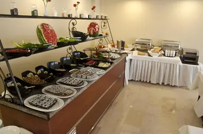 a buffet line with plates and bowls of food at Abel Hotel in Istanbul