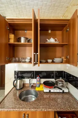 a kitchen with a sink and a counter top at Pi Home & Apartments in Istanbul