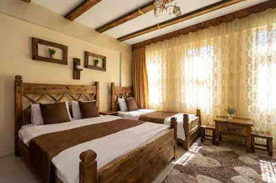 a bedroom with two beds and a window at Pi Home & Apartments in Istanbul