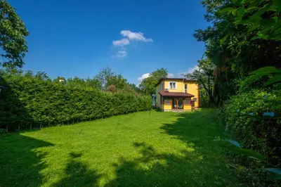a large yard with a house in the background at The Doctor's House in Sapanca