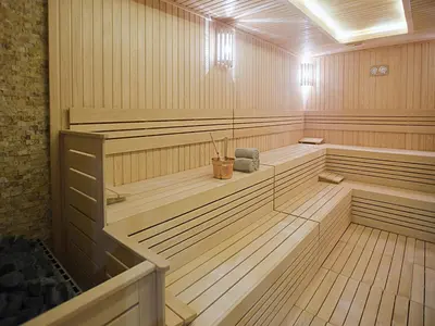 a sauna with wood paneling and aitatingermottermott at Cevahir Hotel Istanbul Asia in Istanbul