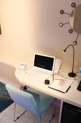 a white desk with a laptop computer on it at Tempo Hotel 4Levent in Istanbul