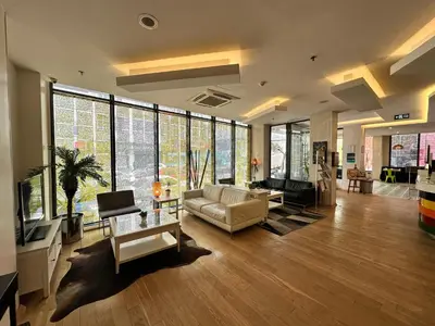 a living room with a couch and a tv at Tempo Hotel 4Levent in Istanbul