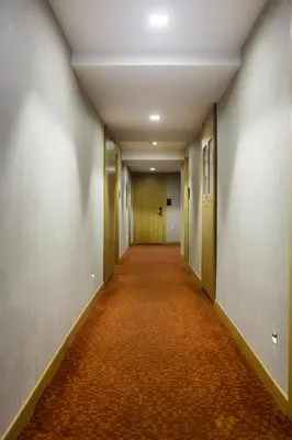 an empty corridor in an office building with an orange carpet at P Galata Hotel - Special Category in Istanbul