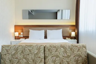 a bedroom with a bed with a couch in front of it at P Galata Hotel - Special Category in Istanbul