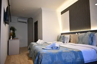 a hotel room with two beds with towels on them at Elite Marmara Hotel Gungoren in Istanbul