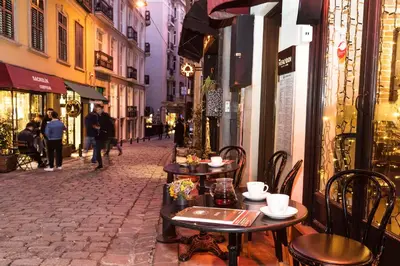a street with tables and chairs on a city street at Meroddi Galata Mansion in Istanbul