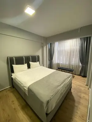 a bedroom with a large bed and a window at Ortakoy Aysem Sultan Hotel in Istanbul