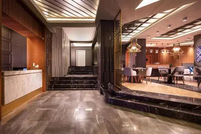 a lobby of a hotel with a table and chairs at B LOFT HOTEL in Bursa