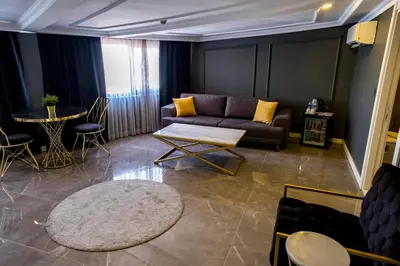 a living room with a couch and a table at B LOFT HOTEL in Bursa