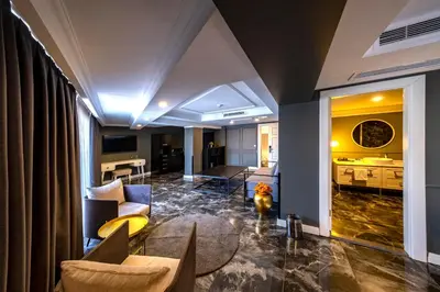 a living room with a couch and a table at B LOFT HOTEL in Bursa