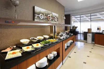 a buffet line with food on display in a restaurant at Balturk House Hotel in Kocaeli