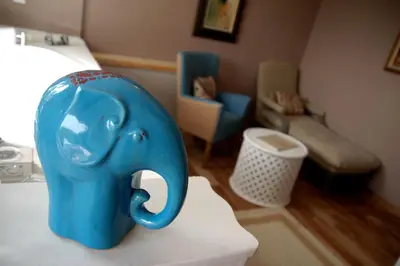 a blue toy elephant sitting on a table in a room at Beyaz Ev Agva - Adult only +15 in Agva