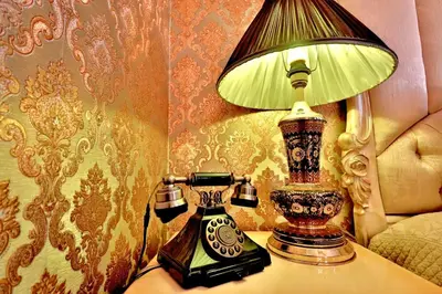 a lamp sitting on a table next to a bed at Blue House Hotel Old City - Sultanahmet in Istanbul