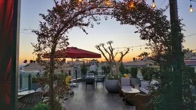 an archway over a patio with tables and chairs at Katelya Hotel in Istanbul