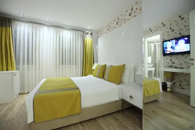 a bedroom with a bed and a television in it at Katelya Hotel in Istanbul