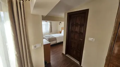 a room with a bedroom with a bed and a door at Ottoman Elegance Hotel in Istanbul