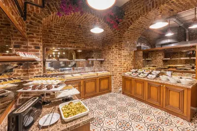 a large kitchen with a bunch of food in it at Meserret Palace Hotel - Special Category in Istanbul