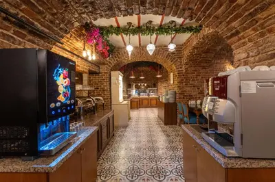 a large room with a kitchen with a counter and a unintention at Meserret Palace Hotel - Special Category in Istanbul